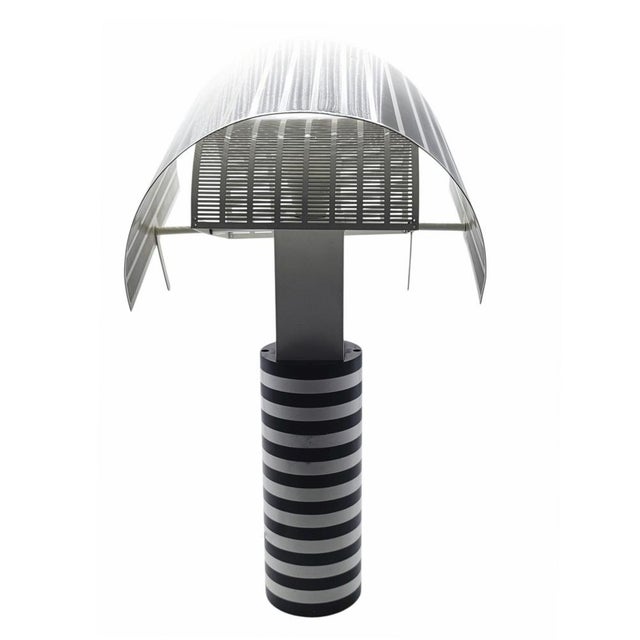 The Shogun is an iconic table lamp designed by the Swiss architect Mario Botta in 1986 for the prestigious Italian brand...