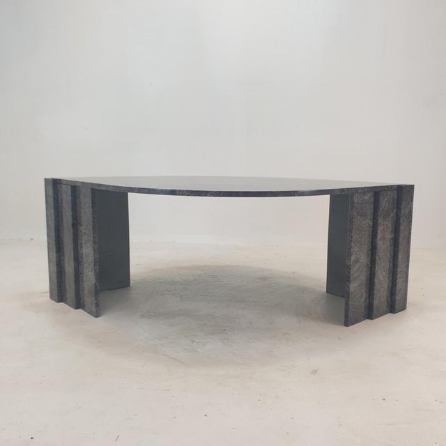 Very elegant Italian coffee table handcrafted out of granite, 1980's. It has a very nice teardrop shaped top. It is made...
