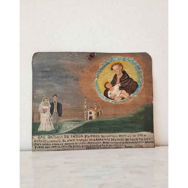 An original hand painted oil on tin panel retablo ex-voto, Mexico, mid 20th century. circa 1948 Highly desirable rare and...