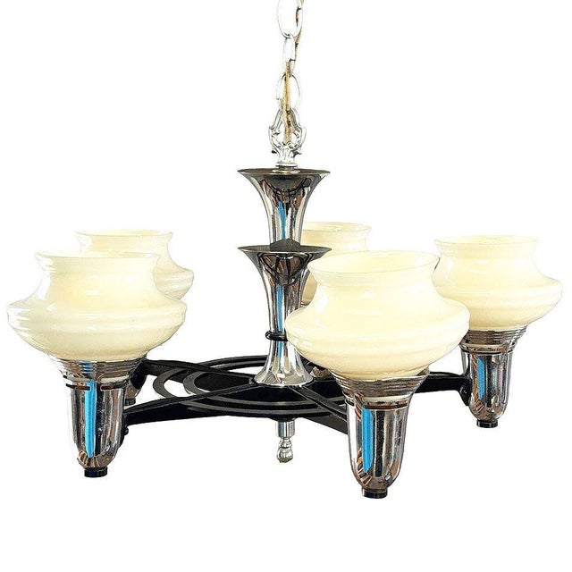 Striking Streamline Moderne five-light chandelier featuring a dramatic combination of chrome-plated metal, black enamel...
