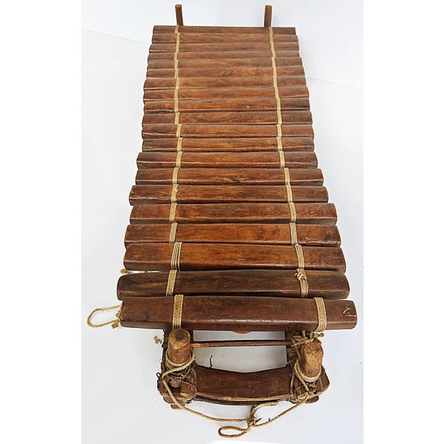 20th-Century Rustic African Xylophone with Wood, Gourds, Rope, and Mallets Offered for sale is a 20th-century rustic...