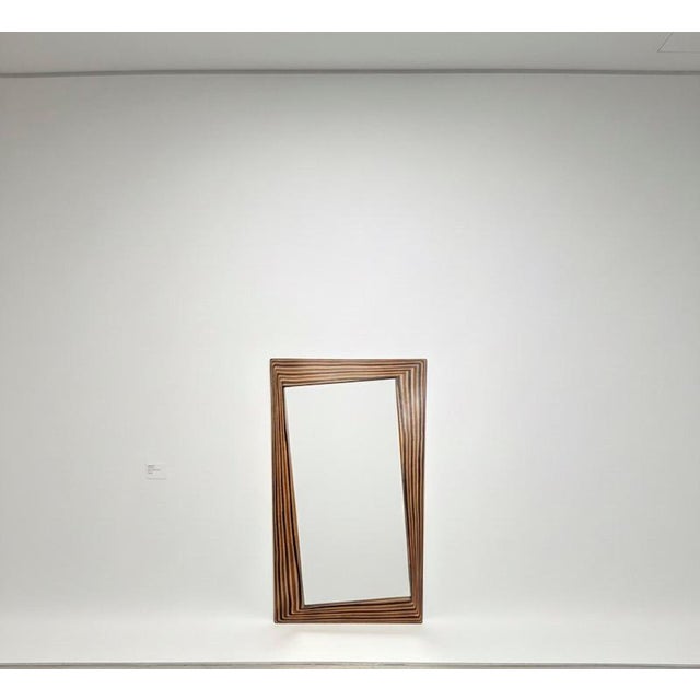 This elegant Italian mirror, with its sophisticated interplay of layers and contrasting wood colors, evokes the aesthetic...