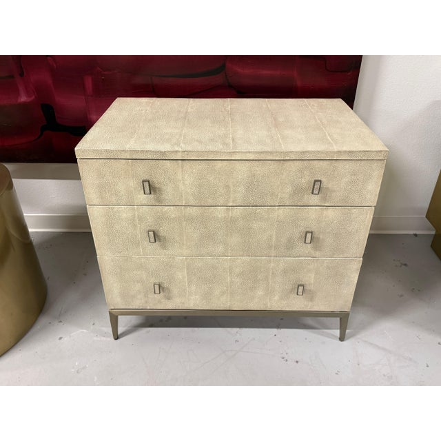 A lovely leather wrapped chest with a shagreen pebbled and colored finish. I believe the metal is bronze. The chest is by...