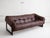 Modernist tufted sofa in brown aniline leather designed by Percival Lafer. Constructed with molded foam, rosewood, and...