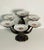 Heavy bronze centerpiece with artichoke leaves in set with dessert reticulated German Shulan plates , floral design.