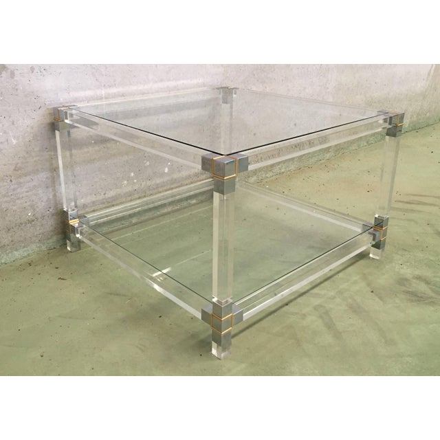 About A square Lucite coffee table with chromed brass details, French, circa 1970 Dimensions big table: H 15.74 in. x W...
