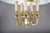 A charming and atmospheric bouillotte-style pendant chandelier, combining a warm polished brass six-light frame with a...