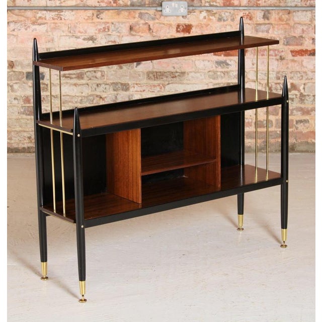 Mid Century G-plan 'Tola and black' -range bookcase model 8726, circa 1960s. Made in African tola with black lacquer and...