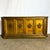 Drenched in old-school glamor, this Hollywood Regency credenza commands attention with its antique gold painted finish and...