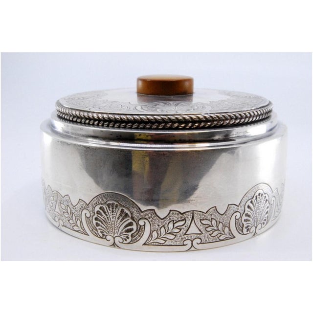 Silver Seashell Vanity Box with Lid Trim and Wooden Handle, in Very Good conditions. Designed 1890 to 1919 This piece has...