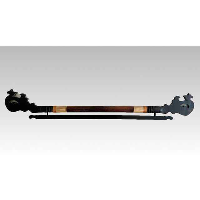Eye catching bamboo and fruitwood hand carved fabric, tapestry or cloth hanger with hand painted decorative foliate...