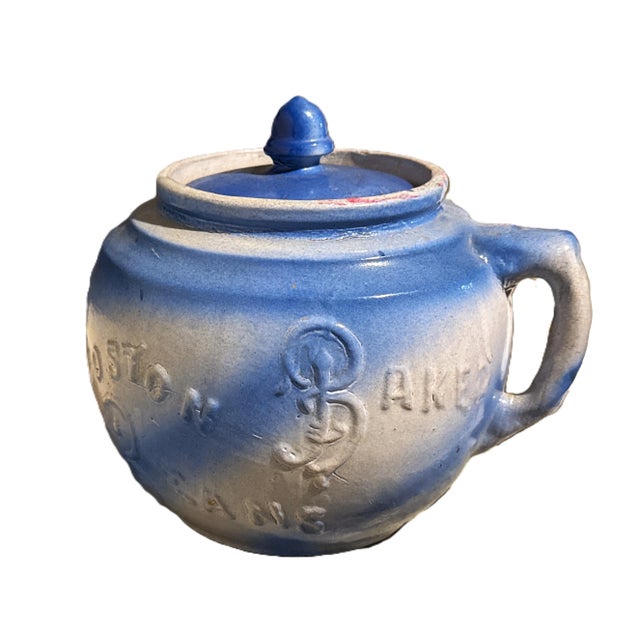 Antique stoneware Boston Baked Beans pot. This early 20th-century crock features a beautiful blue and white salt glaze...