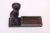 Wooden ebonized cat with dish sculpture mounted to a mahogany plinth. Dish can accommodate keys or smaller objects. Patina...