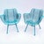 An original pair of wrought iron classic sculptura pattern lounge chairs by Woodard. Each measure 27” x 27” x 25” d. Old...