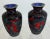 Beautiful pair of small vases. Carved scrolls and village scenes in black on red cinnabar laquer. Blue enemies interior,...