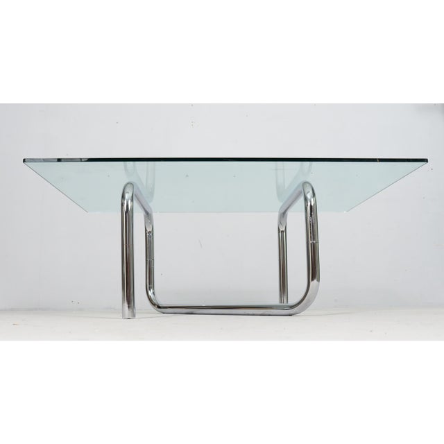 French tubular steel coffee table, 1970s, chrome-plated frame with a glass top (loose). Dimensions approx.: H. 46 cm, D....