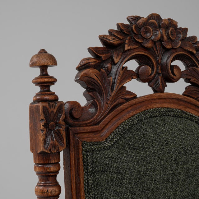 Baroque Revival Oak Armchair with Upholstered Cushions. This richly carved armchair exemplifies the opulent spirit of the...