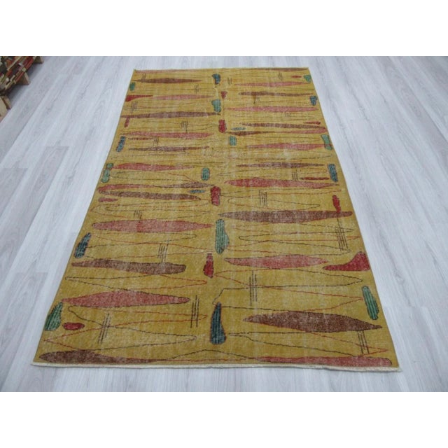 Vintage yellow art deco rug from Oushak region of Turkey. Approximately 50-60 years old. In very good condition