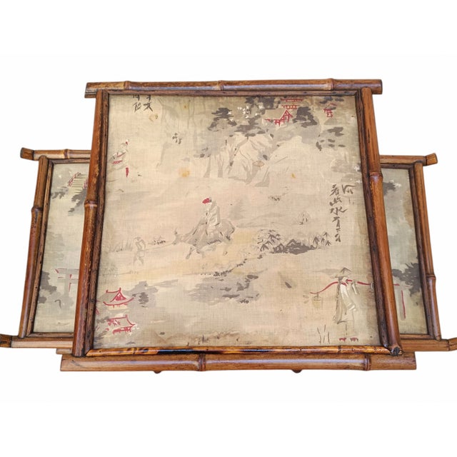 Splendid bamboo etagere with silk shelves painted with antique Japanese designs. It is in excellent original condition and...