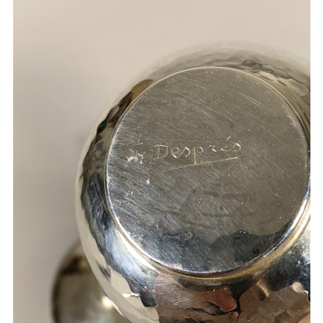 Pair of silver-plated metal cups signed Jean Despres (1889-1980) Silver-plated metal, cold-hammered and polished, creating...