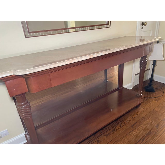 This elegant vintage mahogany console table is a timeless statement piece for any entryway, hallway, living room, or...