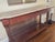 This elegant vintage mahogany console table is a timeless statement piece for any entryway, hallway, living room, or...