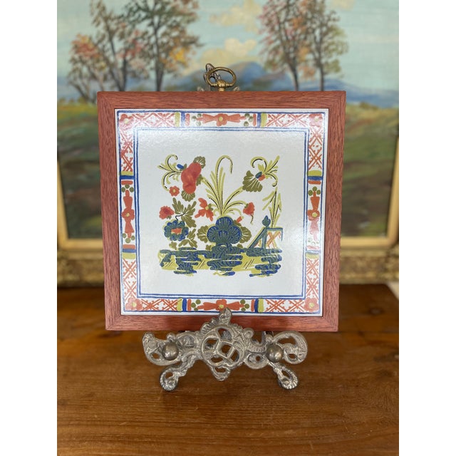 This vintage decorative ceramic tile features a colorful hand-painted floral and landscape motif in the traditional French...