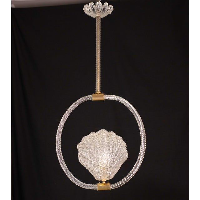 Stunning Murano chandelier by artist Barovier e Toso with murano glass. The pendant consists of 5 glass elements and a...