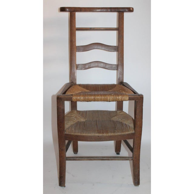 19th century lift top high chair for children with beautiful cane lift top seat.