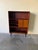 Danish Mid-Century Modern cabinet crafted in richly grained rosewood, dating to the 1960s. This piece features a clean...