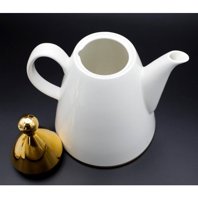 A vitro porcelain coffee service set of pot, creamer and sugar bowl designed by Inkeri Leivo in the late 1980s. Featuring...