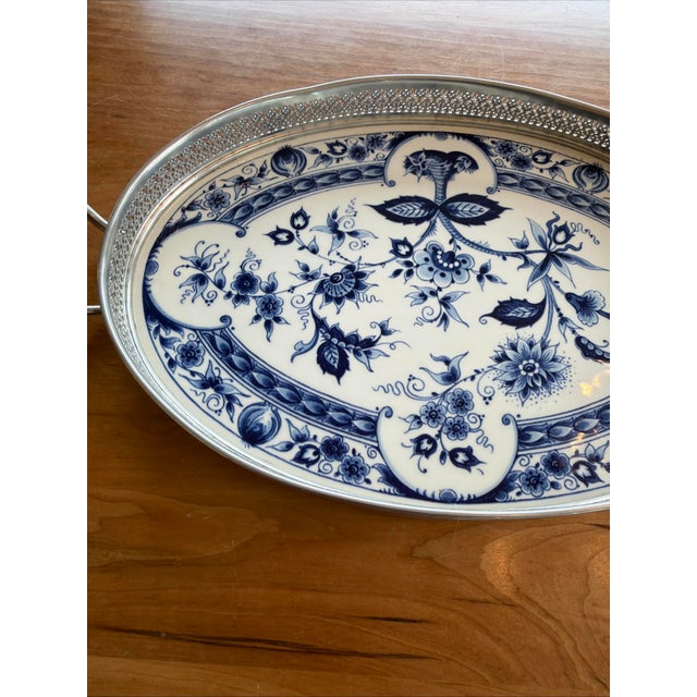 Offered is a large Dutch Delft blue serving tray featuring the classic Flora floral pattern. This is authentic mid-20th-...