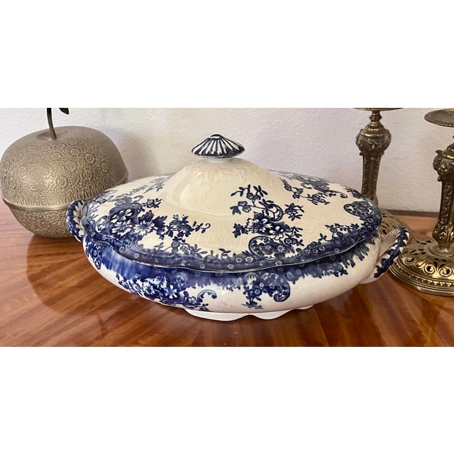 Elevate your tablescape or hutch display with this striking antique English ironstone soup tureen. Manufactured by the...