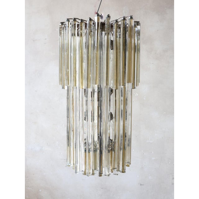 Large Venetian pendant lamp with ‘Triedri’ prisms made of Murano glass, attributed to Venini, circa 1970. The chandelier...