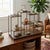 Elevate your cherished collectibles with this exquisite multi-tier wooden tabletop display stand. Featuring a rich brown...