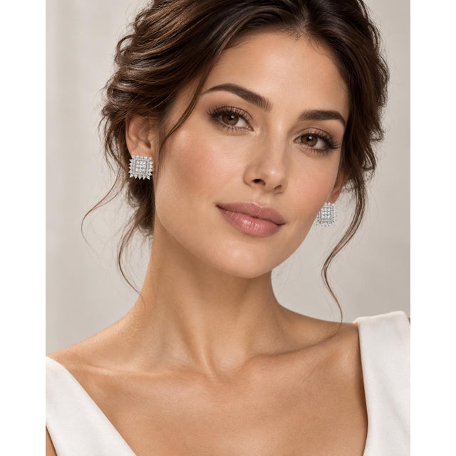 A captivating dance of vintage romance and bold geometry, these striking square cluster earrings frame the face in the...