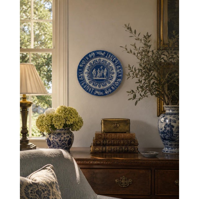 A striking late 20th-century blue and white ceramic plate by Mottahedeh from the discontinued Greek Revival pattern. Based...