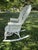 Late Victorian painted wicker rocker with elaborate shell back and scrolling details by Heywood-Wakefield. Some chipping...