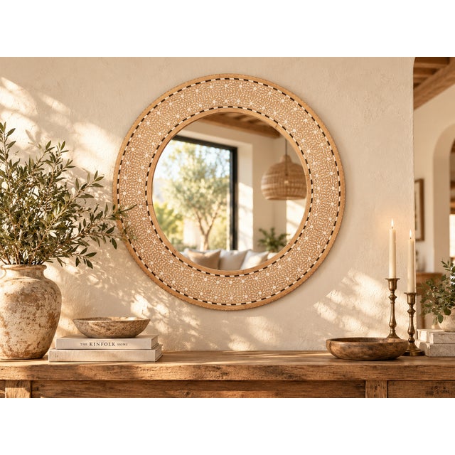 Every inch of this round mirror frame is covered in a continuous vine of white inlay, set into reclaimed teak that has...