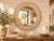 Every inch of this round mirror frame is covered in a continuous vine of white inlay, set into reclaimed teak that has...