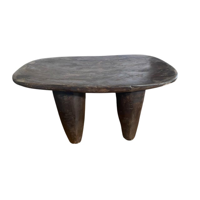 This Senufo milk stool exemplifies the refined aesthetic that has captivated contemporary designers. Hand-carved from a...