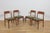 This set of four dining chairs was designed by Henry Kjærnulf for the Danish furniture maker Korup Stolefabrik during the...