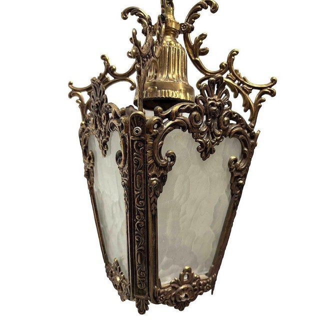 This exquisite Italian Rococo hanging lantern is a true statement piece, crafted from solid brass. Radiates a warm patina...