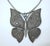 1970's large and in charge butterfly pendant added to a contemporary chain both in a silver metal. The pendant is...