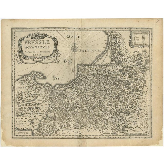 Antique map titled 'Prussiae nova Tabula'. Later edition of Blaeu's map of Prussia, embellished with a large cartouche and...