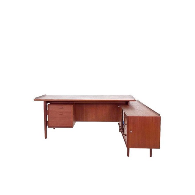 A masterpiece of Danish design: this Arne Vodder desk, Model 209, was designed for Sibast and is one of the most iconic...