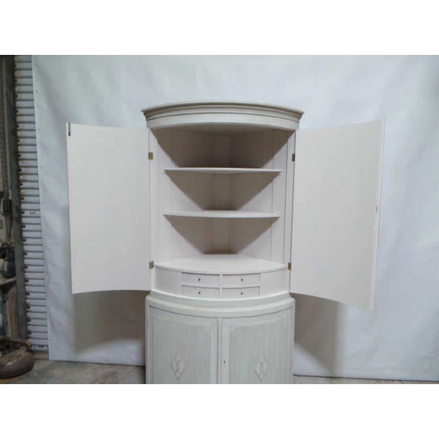 This is a Very Unique Swedish Gustavian style barrel front corner cabinet. its been restored and repainted with Milk...