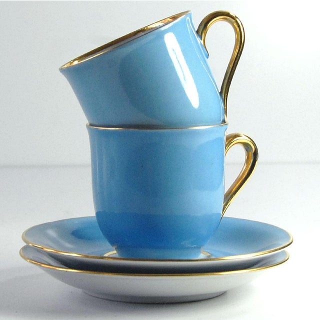A set of two highly decorative coffee cups from Germany from the 1950s. Striking blue color and elegant gilding. Signed....