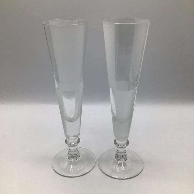 Here is an unusual pair of champagne flutes by Nautica with frosted and clear squares with clear bulb stem.