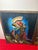 Description A striking mid‑century Mexican folk art pair, hand‑carved and painted with vivid Charro and Serenade motifs —...